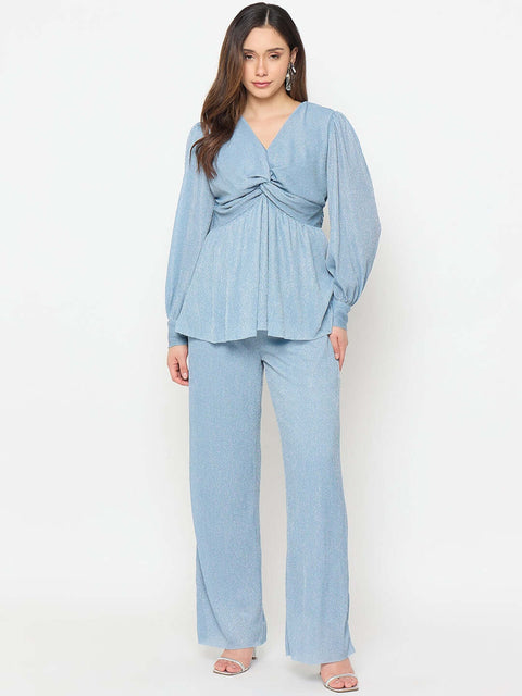 Madame Surplice Neck Blue Co-ord Set modeled by a woman, showcasing the sleek design and flattering silhouette.