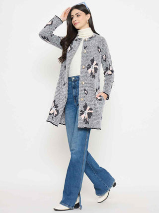 Madame Floral Print Button-Front Black Cardigan worn with jeans and a turtleneck, showcasing a stylish outfit.