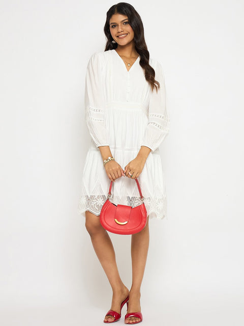 Woman holding a pink handbag against a white background