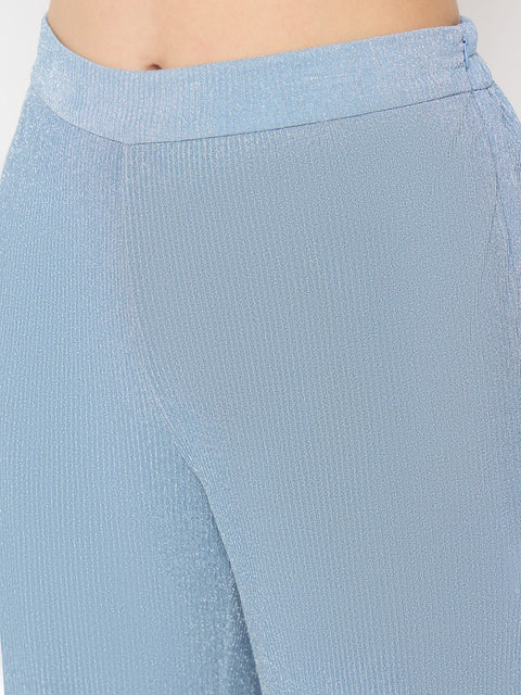 Close-up of the sleek fabric of the Madame Surplice Neck Blue Co-ord Set featuring light blue textured details.